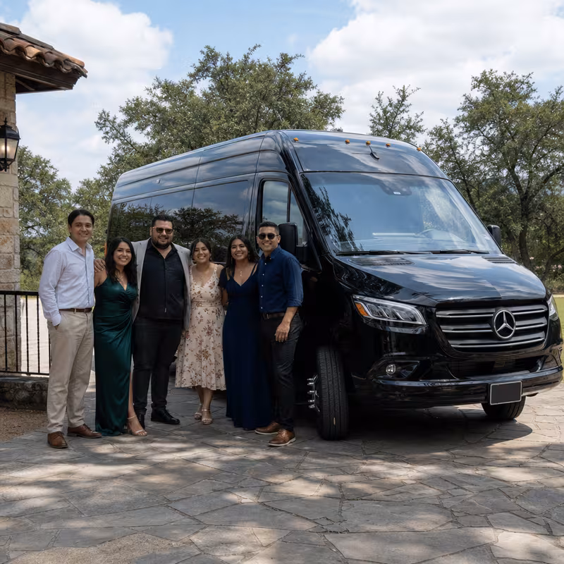 Group beside a Mercedes Sprinter limo from the San Antonio fleet