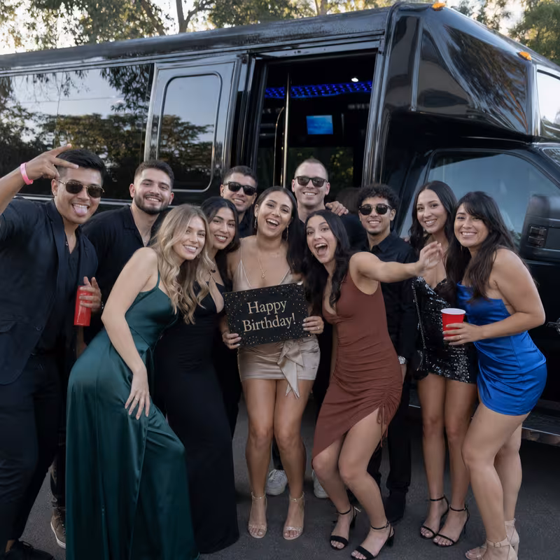 Party bus interior with wraparound leather seating and LED lighting in San Antonio