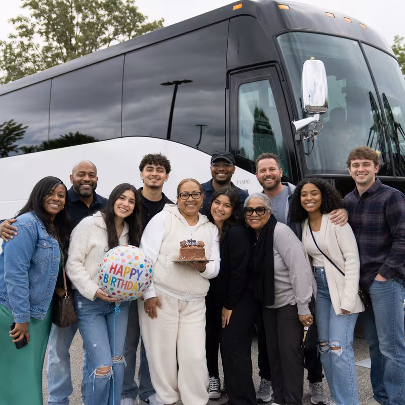 Passengers loading luggage while boarding an San Antonio group shuttle