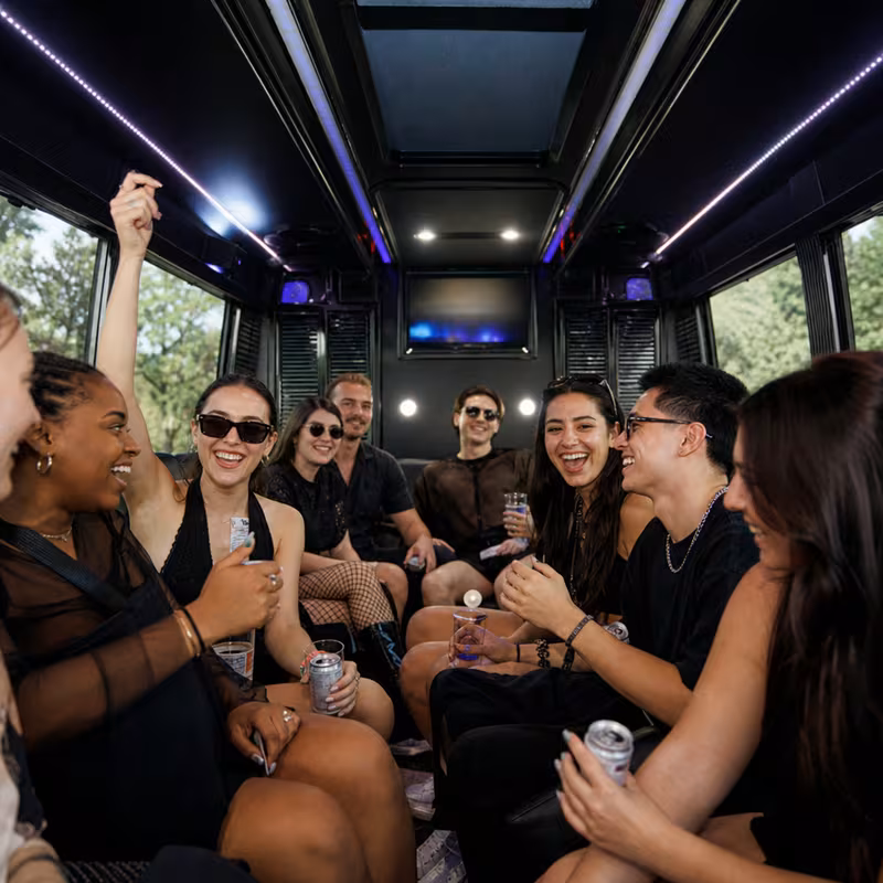 Passengers loading luggage while boarding an San Antonio group shuttle