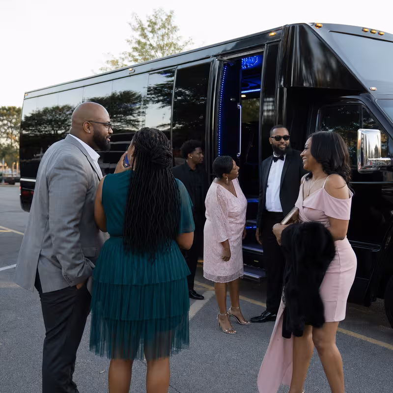 Passengers loading luggage while boarding an San Antonio group shuttle