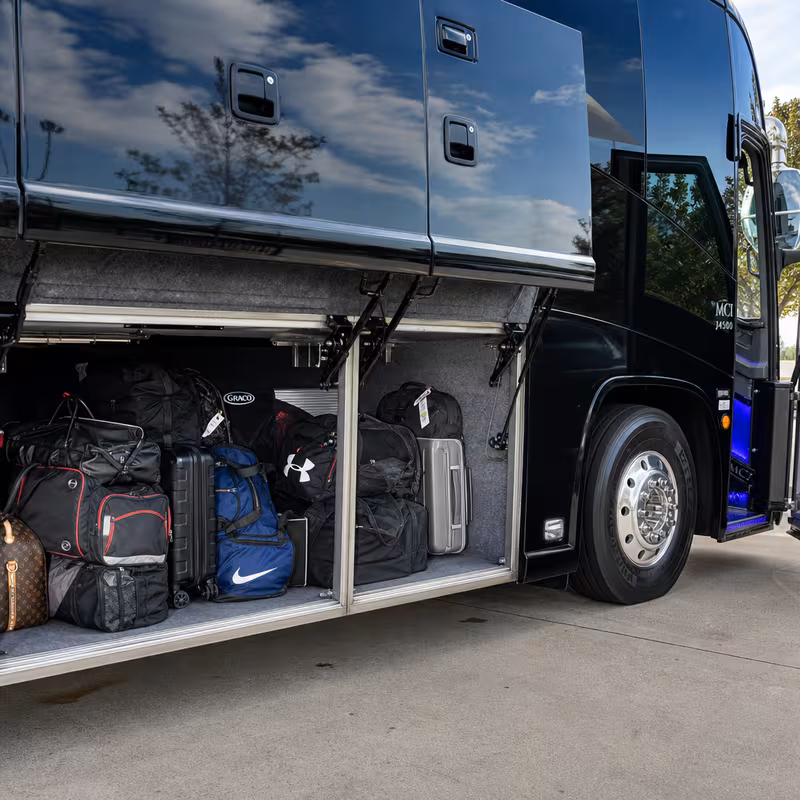 Party bus interior with wraparound leather seating and LED lighting in San Antonio