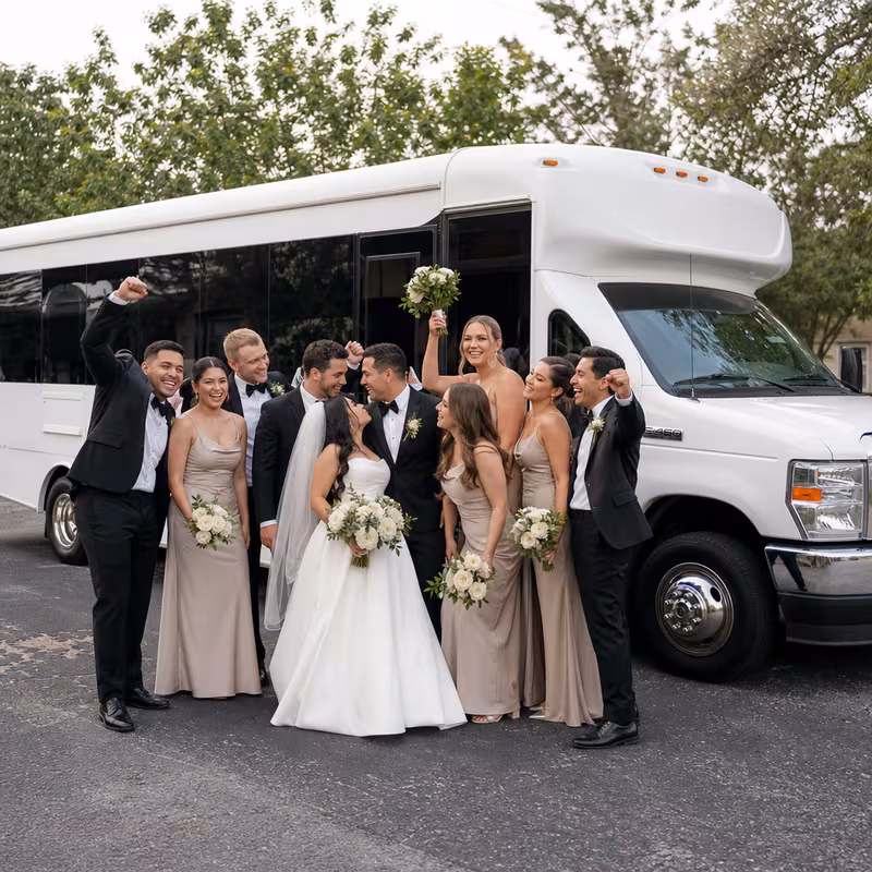 Passengers loading luggage while boarding an San Antonio group shuttle